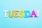 Word tuesday in multicolored letters on