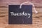 The word Tuesday written on chalk board