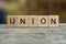 Word union made of brown wooden letters