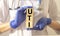 Word uti concept, urinary tract infection inscription on cubes in doctor hands