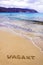 Word Vacant written on sand, on a beautiful beach