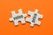 The word Value Price on two matching puzzle on orange background