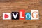 Word `Vlog` on wooden background