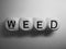 Word weed spelled on dice