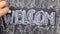 Word WELCOM is written in chalk on a blackboard. Word circled in chalk.