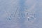 The word Winter written on snow