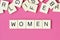 The word Woman written with plastic letters