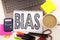 Word writing Bias in the office with laptop, marker, pen, stationery, coffee. Business concept for Prejudice Biased Unfair Treatme