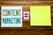 Word, writing Content Marketing. Business concept for Online Media Plan written on sticky note paper on wooden background. Equatio