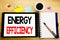 Word, writing Energy Efficiency. Business concept for Electricity Ecology Written on tablet laptop, wooden background with sticky