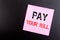 Word, writing Pay Your Bill. Business concept for Payment for Goverment written on sticky note, black background with copy space