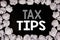 Word, writing Tax Tips. Business concept for Taxpayer Assistance Refund Reimbursement written on black background with copy space