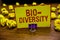 Word writing text Bio Diversity. Business concept for Variety of Life Organisms Marine Fauna Ecosystem Habitat Clip holding yellow