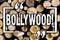 Word writing text Bollywood. Business concept for Indian cinema a source of entertainment among new generation Wooden background