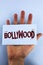 Word writing text Bollywood. Business concept for Indian cinema a source of entertainment written on Sticky Note Paper placed on H