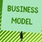 Word writing text Business Model. Business concept for Identifying revenue sources Plan on how to make profit Man stands