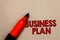 Word writing text Business Plan. Business concept for Structural Strategy Goals and Objectives Financial Projections Open red mark