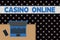 Word writing text Casino Online. Business concept for Computer Poker Game Gamble Royal Bet Lotto High Stakes Upper view