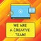 Word writing text We Are A Creative Team. Business concept for Creativity teamwork colleagues brainstorm working Tablet