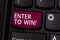 Word writing text Enter To Win. Business concept for Sweepstakes Trying the luck to earn the big prize Lottery Keyboard