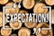 Word writing text Expectation. Business concept for Meteorological research analyst predicts weather forecast Wooden background