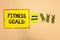 Word writing text Fitness Goals. Business concept for Loose fat Build muscle Getting stronger Conditioning Yellow piece paper remi