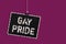 Word writing text Gay Pride. Business concept for Dignity of an idividual that belongs to either a man or woman Hanging blackboard
