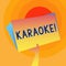 Word writing text Karaoke. Business concept for Entertainment singing along instrumental music played by a machine Hand