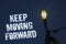 Word writing text Keep Moving Forward. Business concept for improvement Career encouraging Go ahead be better Light post dark blue