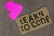 Word writing text Learn To Code. Business concept for Learn to write Software Be a Computer Programmer Coder Piece squared paperbo