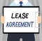 Word writing text Lease Agreement. Business concept for Contract on the terms to one party agrees rent property