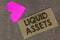 Word writing text Liquid Assets. Business concept for Cash and Bank Balances Market Liquidity Deferred Stock Piece squared paperbo