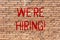 Word writing text We Re Hiring. Business concept for Talent Hunting Job Wanted Recruitment Brick Wall art like Graffiti