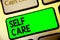 Word writing text Self Care. Business concept for Give comfort to your own body without professional consultant Keyboard green key