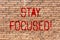 Word writing text Stay Focused. Business concept for Maintain Focus Inspirational Thinking Brick Wall art like Graffiti