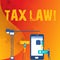 Word writing text Tax Law. Business concept for governmental assessment upon property value or transactions Staff
