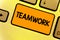 Word writing text Teamwork. Business concept for Group of people who work together as one and with the same aim Keyboard yellow ke