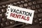 Word writing text Vacation Rentals. Business concept for Renting out of apartment house condominium for a short stay
