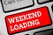 Word writing text Weekend Loading. Business concept for Starting Friday party relax happy time resting Vacations Keyboard red key