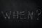 When ? The word when written in chalk on a blackboard - one of the essential questions in journalism and communication