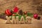 The word xmas in front of a wooden background