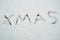 Word xmas written in snow