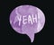 The word yeah on a watercolor speech bubble