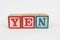 The Word Yen in Wooden Childrens Blocks