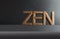 The word Zen carved in wooden letters on a grey background ,concept of balanced lifestyle