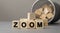 Word ZOOM made with cube wooden block on a desk