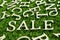 Wording sale on artificial green grass background