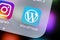 Wordpress application icon on Apple iPhone X screen close-up. Wordpress app icon. Wordpress.com application. Social network