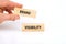 Words Brand visibility on wooden blocks assembled by hand