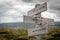 words have power text engraved on old wooden signpost outdoors in nature